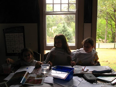 The three young girls doing craft together