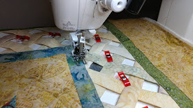 Open weave batik lattice quilt with prairie points