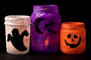 upcycle old jars or vases and make Halloween candle goblins