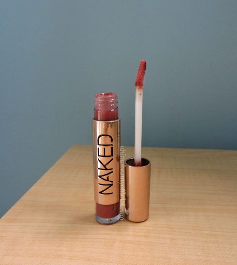 Open tube of Urban Decay Naked Lip gloss with applicator