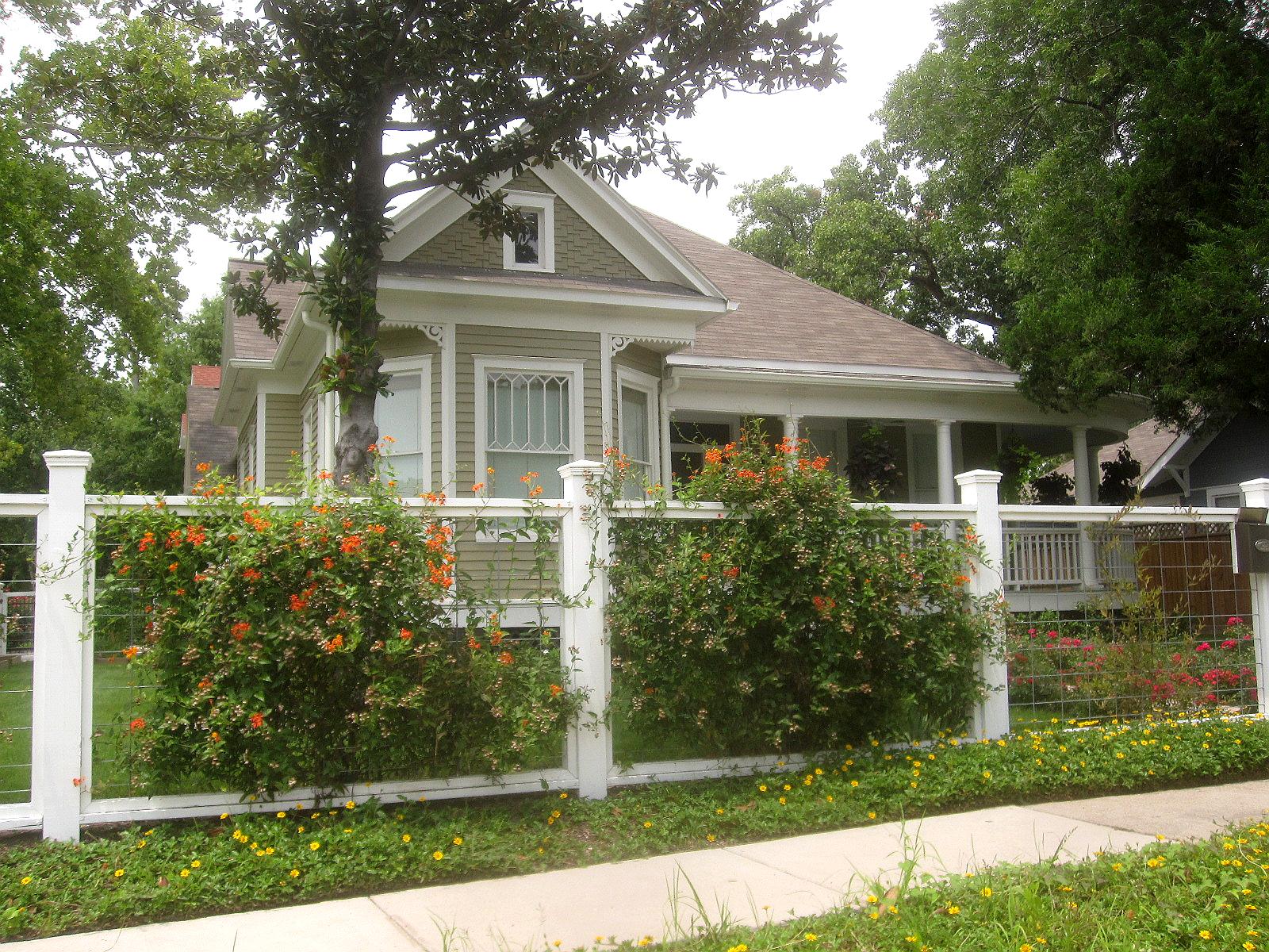 Another type of fence garden filled with rambling floral vines adds to ...