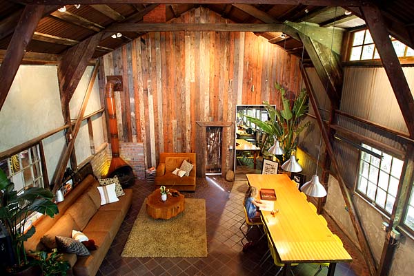 view from above living room with dinning table and couch beautiful lighting and wood texture