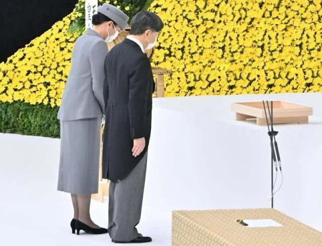 Emperor Naruhito and Empress Masako offer a moment of silence to the war dead during a memorial ceremony