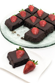 Chocolate strawberry cubes dark chocolate one cube on a plate