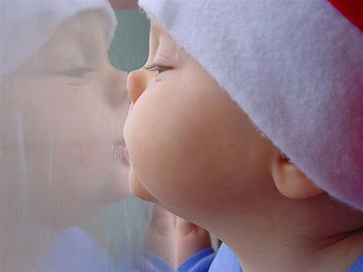 beautiful cute kid boy infront of mirror