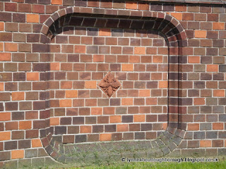 Terracotta tile in brickwork