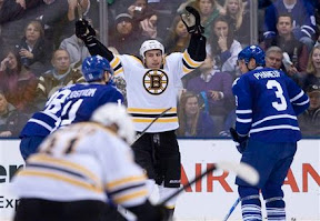 Milan Lucic celebrates Marc Savard's goal