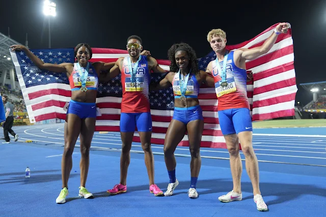 May 5, 2024; Nassau, Bahamas; Members of the USA mixed 4 x 400m relay (from left) Kendall Ellis, Willington Wright, Lynna Irby-Jackson and Matthew Boling, pose after winning in a championship record 3:10.73 during the World Athletics Relays at Thomas A. Robinson National Stadium. Mandatory Credit: Kirby Lee-USA TODAY Sports  Kirby Lee