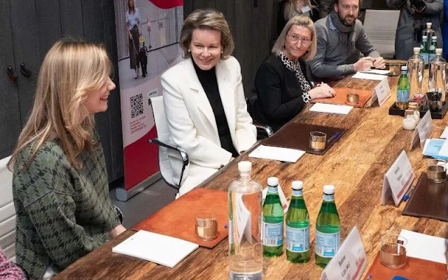 Queen Mathilde wore a new white cashmere long midi coat by Giorgio Armani, and black turtleneck sweater and black trousers