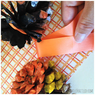 Make an Easy Rustic Halloween Garland with Painted Pinecones