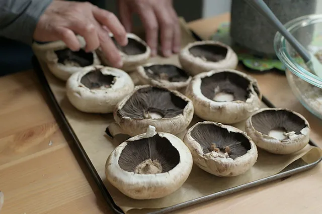 Arrange mushrooms on baking tray lined with baking paper.