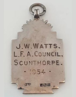 Picture one of football medal awarded to a Brigg official in 1923