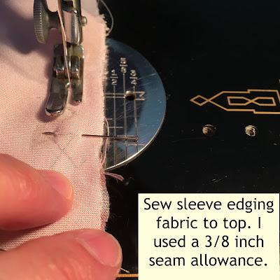 Instructions on sewing sleeve edging fabric to top.