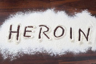 Woman held with 500gm heroin in city