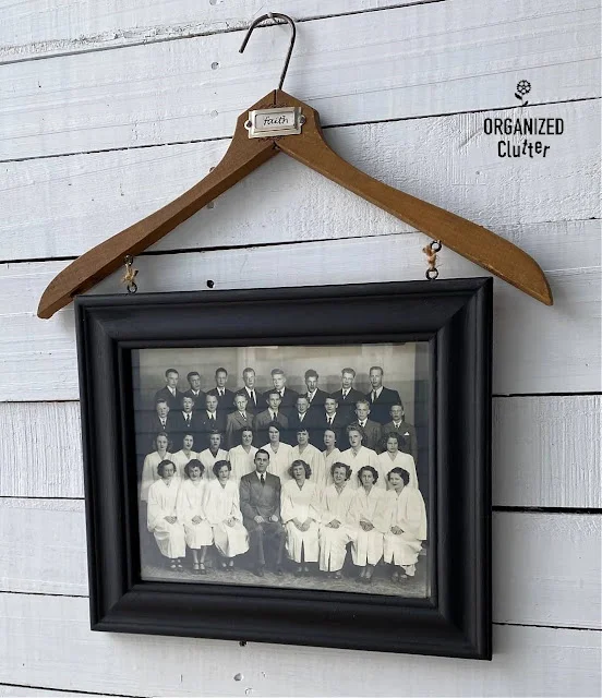 Photo of a photo frame/clothes hanger display.