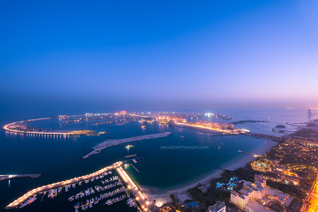 Photo of palm island in Dubai at night as seen from one of the skyscrapers