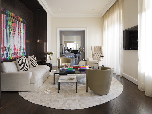 Photo of living room with dark walls and bright furniture