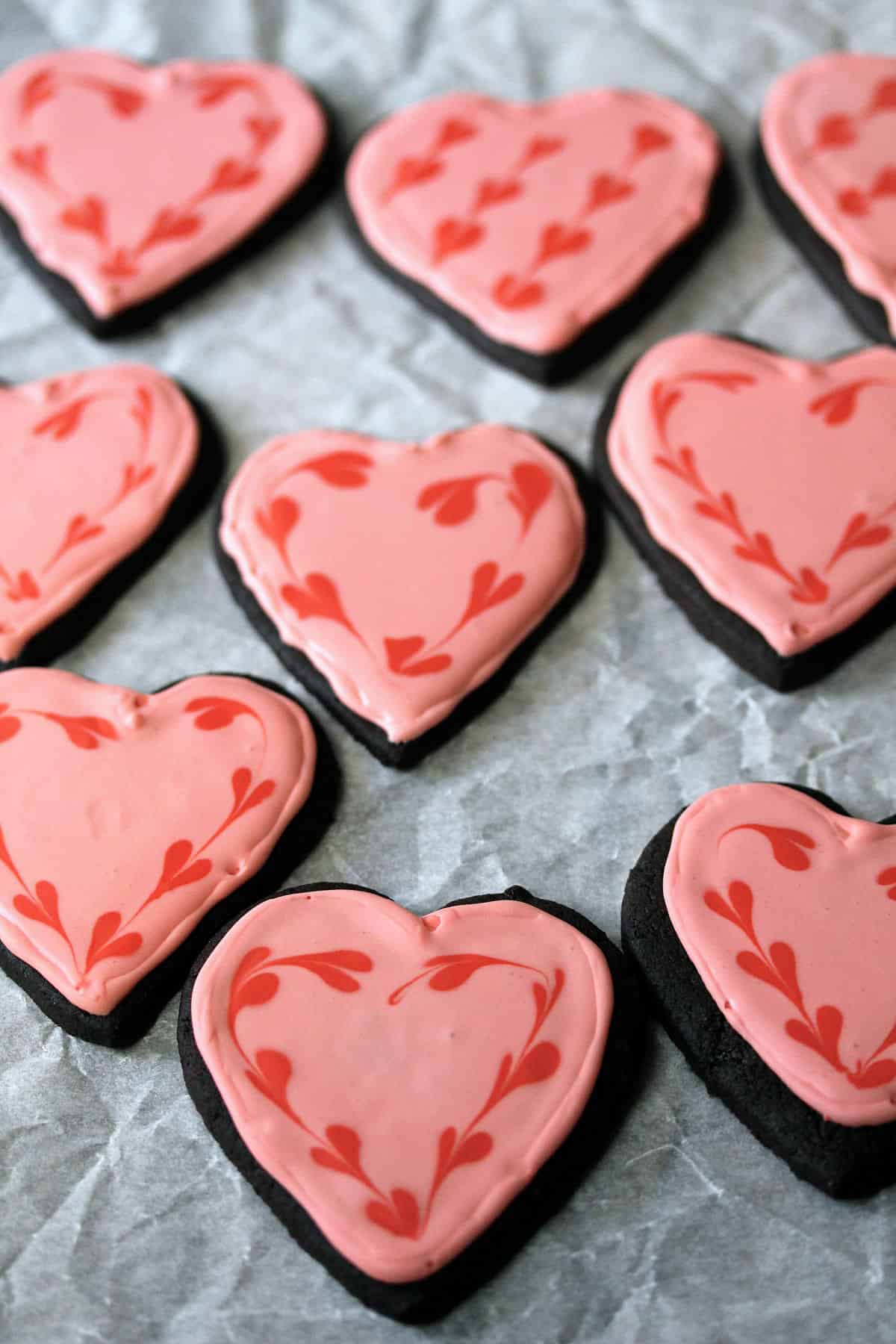 Chocolate Valentine Sugar Cookies with hearts in the icing.