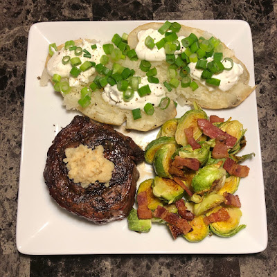 Rare grilled Prime ribcap, bacon roasted Brussels sprouts and baked potato with sour cream and scallions