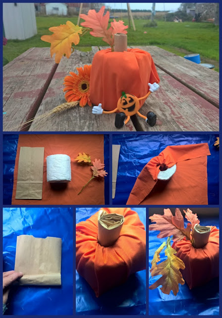 A Halloween pumpkin made with a roll of toilet paper.