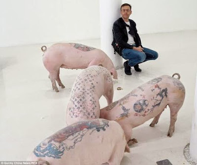 Skins of pigs tattooed with designer logos & other characters being sold for up to £55,000 a piece