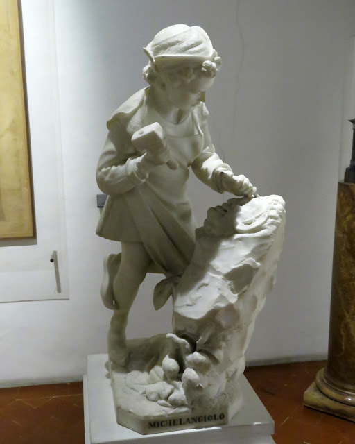 The young Michelangelo carving the head of a faun by Cesare Zocchi, Casa Buonarroti, Via Ghibellina, Florence