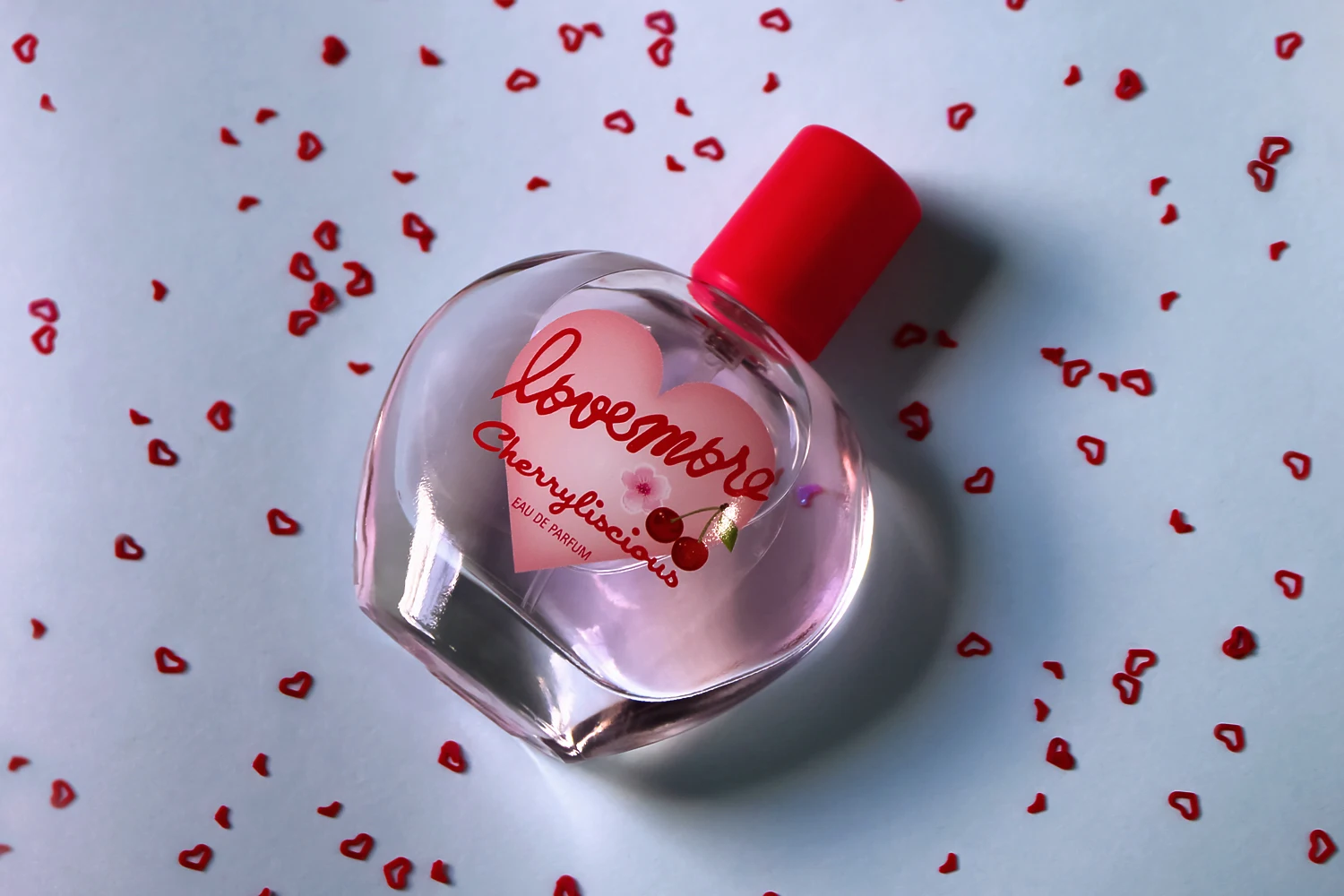 close-up of a perfume bottle on a plain background in natural light