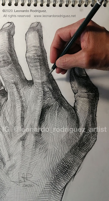 Drawing of hand, study of light and shadows with pencil cross hatching.