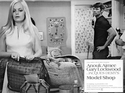 Alexandra Hay and Gary Lockwood in a non-automotive scene. She's packing to leave him.