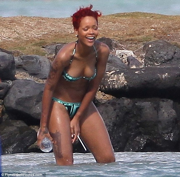 Rihanna already has over a dozen tattoos over her body this gun tattoo is