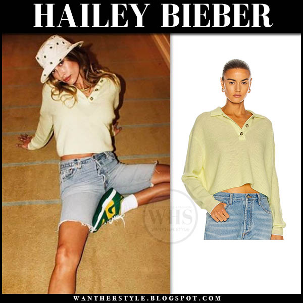 Hailey Bieber in yellow sweater and denim shorts