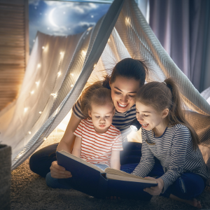 Mamá leyendo con sus hijas en cuarto adaptado para un apprendizaje motivador