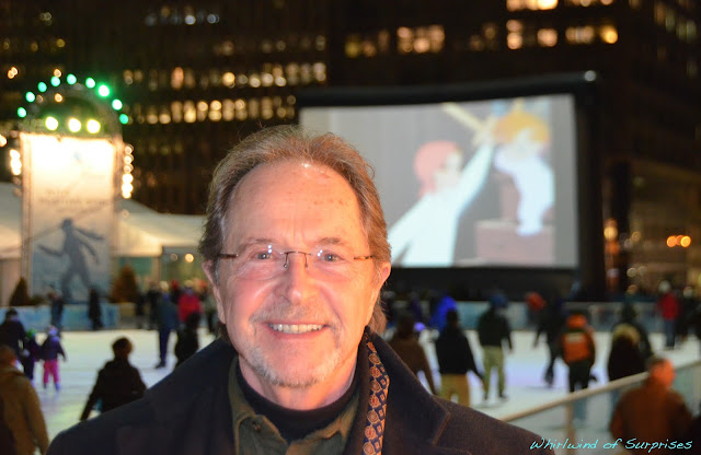 Paul Collins at Bryant Park in front of the screen showing his character, John Darling, sword fighting with his younger brother, Michael Darling. #PeterPanDiamond