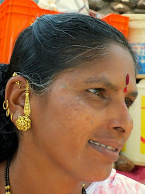 Woman with gold earrings