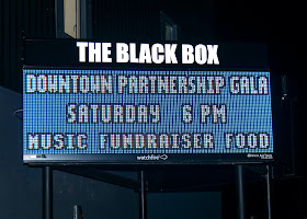 sign on THE BLACK BOX marque
