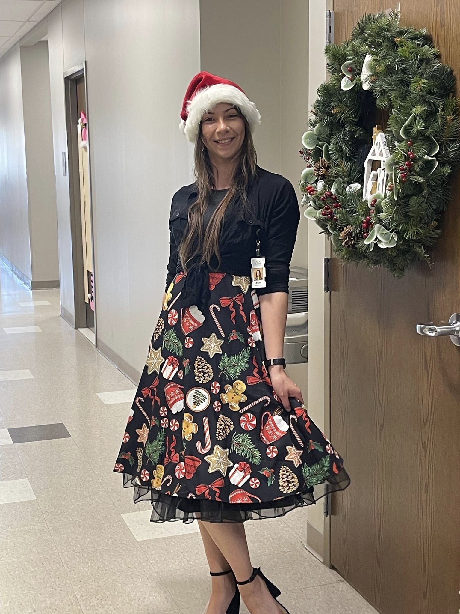 woman with a christmas skirt and santa hat