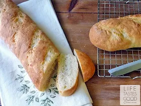 Vietnamese Baguette on cutting board with a couple slices cut and ready to eat