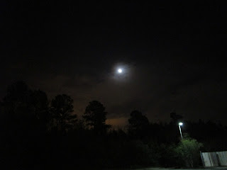 The Moon and an orange cloud (and a light) seen from a CVS on Highway 55. ©