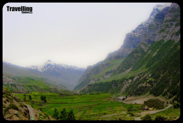 Travelling Camera on back journey from Famous Shiva Temple @ Trilokinath, Lahaul and Spiti, Himchal Pradesh...This blog PHOTO JOURNEY was started on first July of 2008 and very first post was about Lahaul and Spiti... Here I am going to share some of the photographs of back journey from Trilokinath which is in Lahul district of Himachal Pradesh...Photographs licked near Tandi Bridge... As you can see in above photographs.. Tandi-0 km :)Tandi is a place in Lahaul and Spiti District of Himachal Pradesh, where Chandra River and Bhaga river meets to make Chandrabhaga....The Chandrabhaga River is also known as Chenab which is formed by the confluence of the Chandra and Bhaga rivers at upper Himalyas. It flows through the Jammu region of Jammu and Kashmir into the plains of the Punjab, forming the boundary between the Rechna and Jech interfluves. It is joined by the Jhelum River at Trimmu and then by the Ravi River Ahmedpur Sial. It then merges with the Sutlej River near Uch Sharif, Pakistan to form the Panjnad or the 'Five Rivers', the fifth being the Beas River which joins the Satluj near Ferozepur, India. For more info CLICK HEREFrom this journey, I am not able to recall any moment when snow covered Himalyas were not visible from our car.. They were everywhere... I think Lahaul and Spiti district is amazing place to chill out.. but it has another side to it.. While we were at Trilokinath, we spent some time with Pandit ji there and we got to know that most the areas disconnects from rest of the world for 7 months in an year... Can you imagine yourself living in an area for 7 months without any access to vehicles n all... Its really tough but they have planned their life according to their local eco-system...While travelling in Lahaul and Spiti, we can see beautiful valleys along with snow capped hills of Himalyan Range... This region is rich in terms of Agriculture... I am not sure about the whole district but area between Manali and Keylong had lot many valleys with agricultural land...Towards north of the state is a snow capped Trans Himalayan district of Himachal Pradesh comprising of two major valleys Lahaul and Spiti. The district is lying on the Hindustan-Tibet border... It is a tribal district with unique Tibetan Buddhist culture...