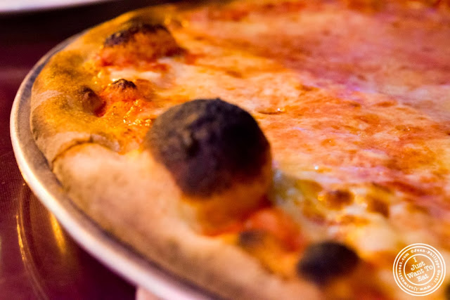 image of traditional pizza at John's pizzeria in Times Square, NYC, New York