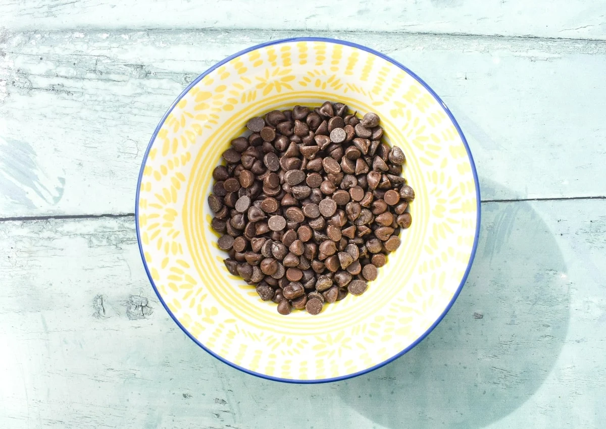 Dark chocolate chips in a bowl.