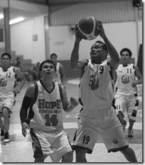 Dennis Bernabe (R) of Shun Wei prepares to go for a layup over Arnold Buan of Hope in their Group A match of the 2nd Queenielin's Cup at the Brunei Basketball Association court in Batu Bersurat last night. Picture: BT/Yee Chun Leong 