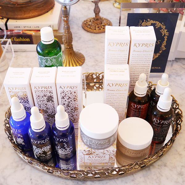 Kypris beauty products on a silver mirrored tray