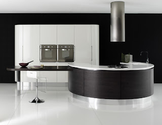 wall oven in contemporary curved kitchen in black and white