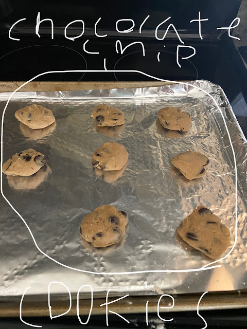 A baking pan with chocolate chip cookies ready for the oven.