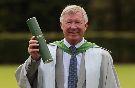 Sir Alex Ferguson poses after being awarded an honorary doctorate degree by Stirling University