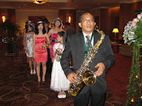The saxophonist getting ready to usher in the wedding couple during their entrance