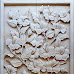 Relief batu putih gambar motif bunga sepatu
