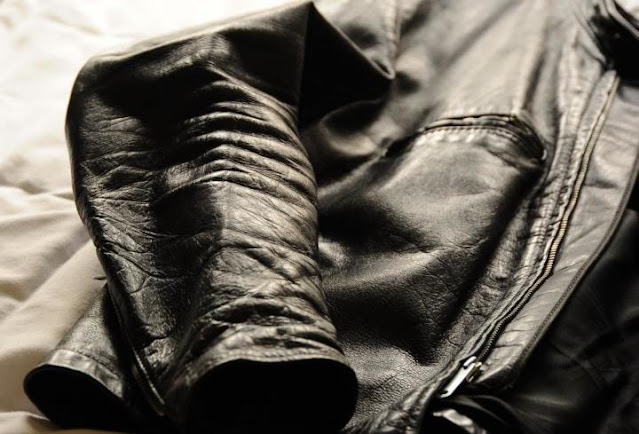 How does one remove creases from a genuine leather jacket?