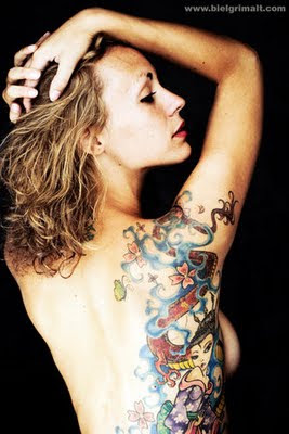 Sexy Female with Tattoo Design on Her Side Body